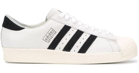 witte adidas met geel en zwarte strepen|adidas Superstar .